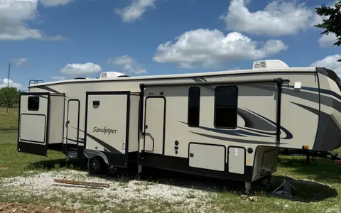 Camp with Comfort  Forest River Sandpiper 384QB0K Fifth Wheel