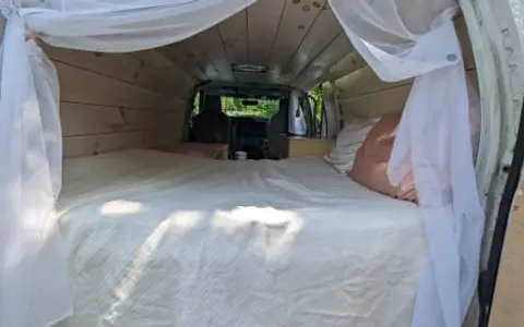 Cozy n cute 2014 Ford Econoline - sink, solar power, wood paneling